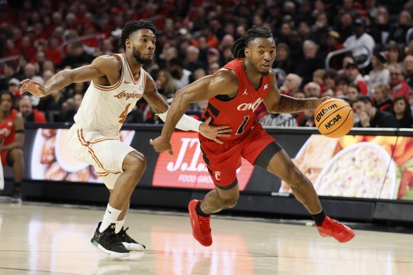 Disu scores career high 33 points No. 25 Texas survives at